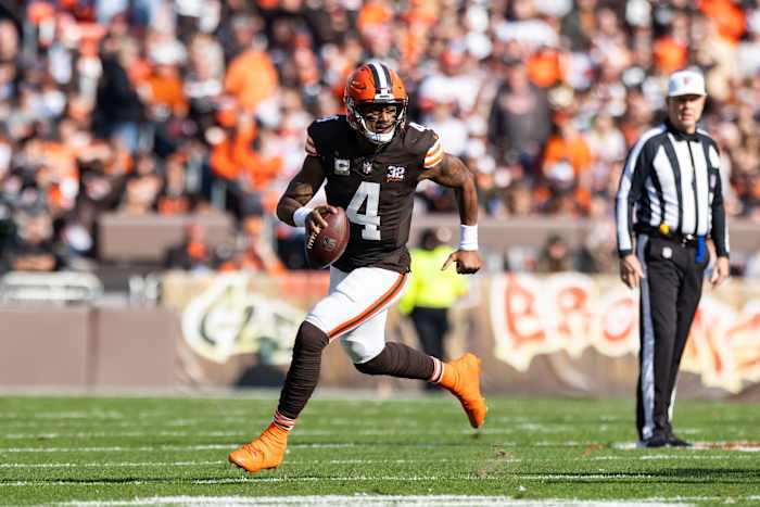 Cleveland Browns quarterback Deshaun Watson (4) runs the ball against the Arizona Cardinals during the second quarter at Cleveland Browns Stadium.